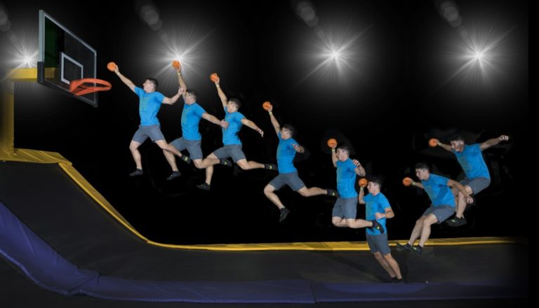 Composite shot of man dunking basketballs.