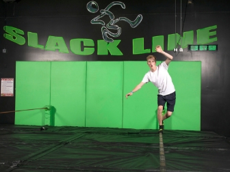 Boy balancing on a slackline at Get Air.