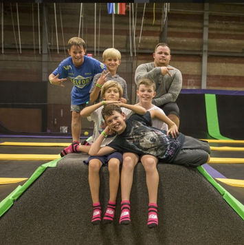 Group of kids posing on a jump box, YouTube page